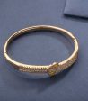 Dangling Golden Color Brass Bracelet (Brass) on Sale